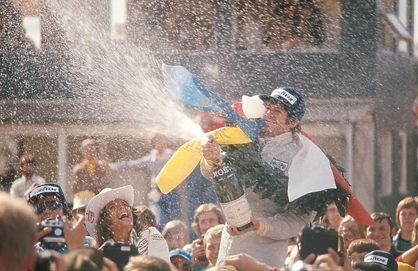 1974 Swedish Grand Prix: Jody Scheckter 1st position, celebrates taking his maiden Grand Prix win on the podium