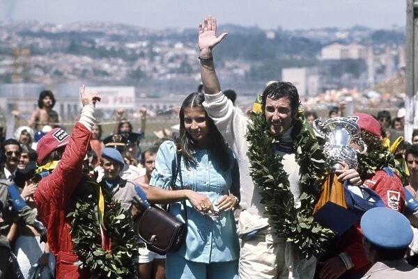 1975 Brazilian Grand Prix: Carlos Pace 1st position, celebrates winning his home Grand Prix, taking his maiden and only win. Emerson Fittipaldi