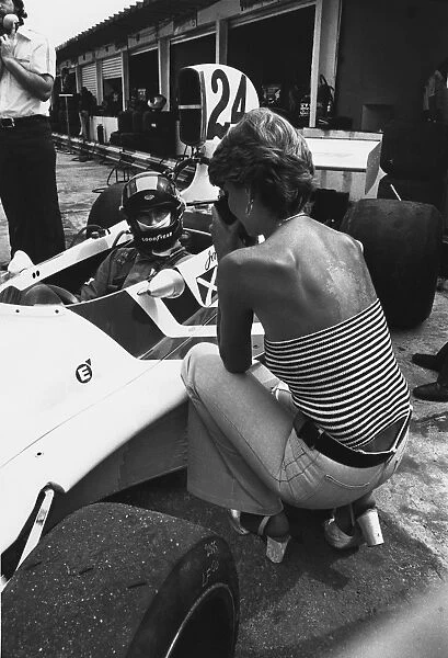 1975 Brazilian Grand Prix: James Hunt, 6th position, wife Susie takes a close up picture of her husband before qualifying, portrait