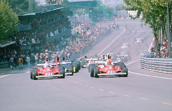 1975 Spanish Grand Prix. Monjuich Park, Barcelona, Spain. 25-27 April 1975. Niki Lauda leads away with teammate Clay Regazzoni (both Ferrari 312T's) and Mario Andretti (Parnelli VPJ4 Ford)