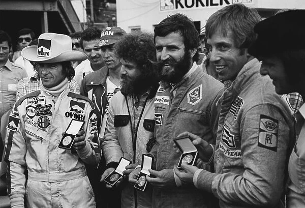 1976 Austrian Grand Prix: Arturo Merzario, a representative of Guy Edwards, Harald Ertl and Brett Lunger receive medals for saving Niki Lauda