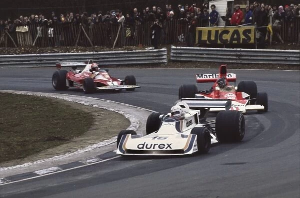 1976 British Grand Prix: Alan Jones, 5th position, leads James Hunt, Disqualified and Niki Lauda, 1st position, action