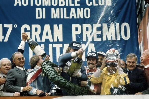 1976 Italian Grand Prix: Ronnie Peterson, 1st position, celebrates with Clay Regazzoni, 2nd position and Jacques Laffite, 3rd position, on the podium