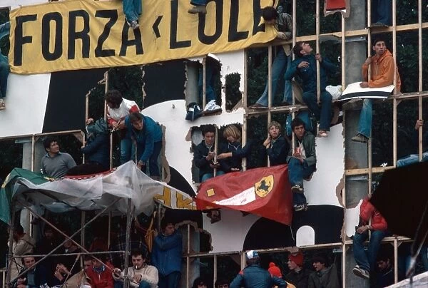 1976 Italian Grand Prix: The Tifosi take to whatever means possible to get a decent view of the Ferrari cars, atmosphere