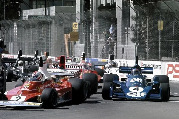 1976 United States Grand Prix West - Start: Clay Regazzoni, 1st position, leads Patrick Depailler, 3rd position and James Hunt, retired, at the start
