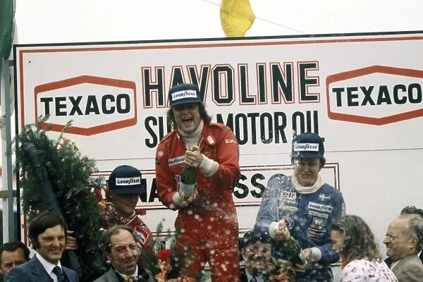 1977 Belgian Grand Prix - Podium: Gunnar Nilsson, 1st position, celebrates with Ronnie Peterson, 3rd position and Niki Lauda, 2nd position, podium
