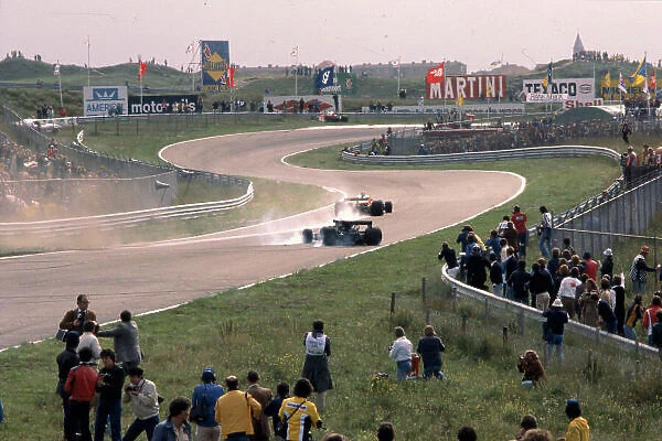 1977 Dutch Grand Prix. Zandvoort, Holland. 26-28 August 1977. James Hunt (McLaren M26 Ford) and Mario Andretti (Lotus 78 Ford) have a collision on lap 5. Ref-77 HOL 14. World Copyright - LAT Photographic