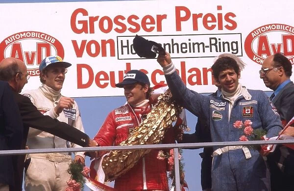 1977 German Grand Prix: Niki Lauda 1st position, Jody Scheckter 2nd position and Hans-Joachim Stuck 3rd position on the podium