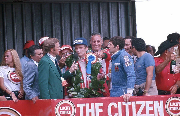 1977 South African Grand Prix. Kyalami, South Africa. 3-5 March 1977. Niki Lauda (Ferrari) 1st position and Jody Scheckter (Wolf Ford) 2nd position on the podium. Ref-77 SA 06. World Copyright - LAT Photographic