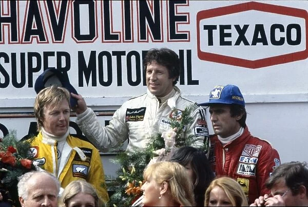1978 Belgian Grand Prix: Mario Andretti 1st position, with Ronnie Peterson, 2nd position and Carlos Reutemann 3rd position on the podium, portrait