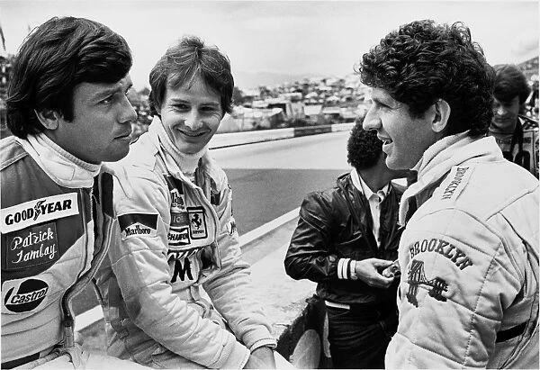 1979 Austrian Grand Prix: Gilles Villeneuve chats with team mate Jody Scheckter and Patrick Tambay in the pits, portrait