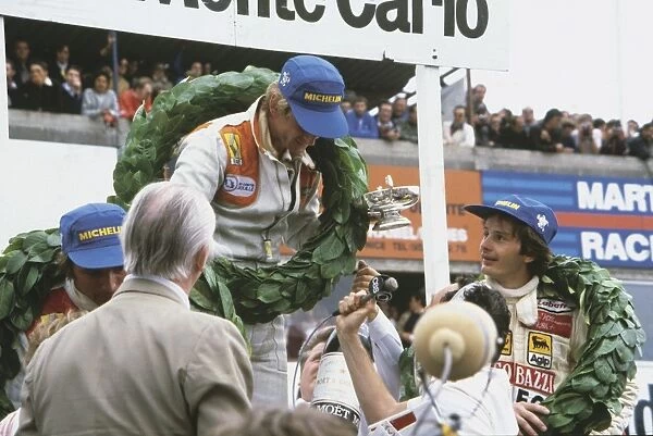 1979 French Grand Prix: Jean-Pierre Jabouille 1st position with Gilles Villeneuve 2nd position and Rene Arnoux 3rd position, on the podium, portrait