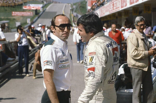 1980 Austrian Grand Prix. Osterreichring, Austrian. 15-17 August 1980. Williams team boss Frank Williams talks with his driver Alan Jones. Ref-80 AUT 12. World Copyright - LAT Photographic