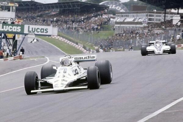 1980 British Grand Prix. Brands Hatch, Great Britain. 11-13 July 1980. Alan Jones (Williams FW07B-Ford Cosworth), 1st position, leads Nelson Piquet (Brabham BT49-Ford Cosworth)