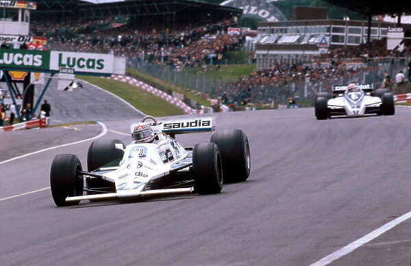 1980 British Grand Prix. Brands Hatch, England. 11-13 July 1980. Alan Jones (Williams FW07B Ford) 1st position at Paddock Hill Bend, with Nelson Piquet (Brabham BT49 Ford) behind. Ref-80 GB 17. World Copyright - LAT Photographic