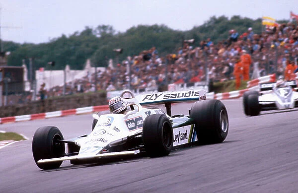 1980 British Grand Prix. Brands Hatch, England. 11-13 July 1980. Alan Jones (Williams FW07B Ford) 1st position at Paddock Hill Bend. Ref-80 GB 01. World Copyright - LAT Photographic