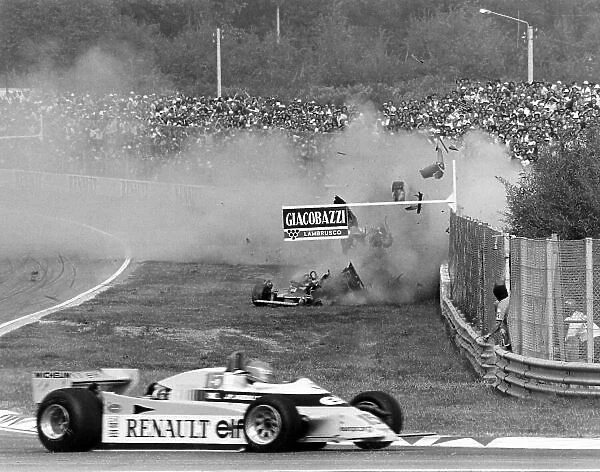 1980 Italian Grand Prix. Imola, Italy. 12-14 September 1980. Jean-Pierre Jabouille (Renault RE20) passes as Gilles Villeneuve (Ferrari 312T5) crashes out of the race. Accident. World Copyright: LAT Photographic Ref: 14056 / 31