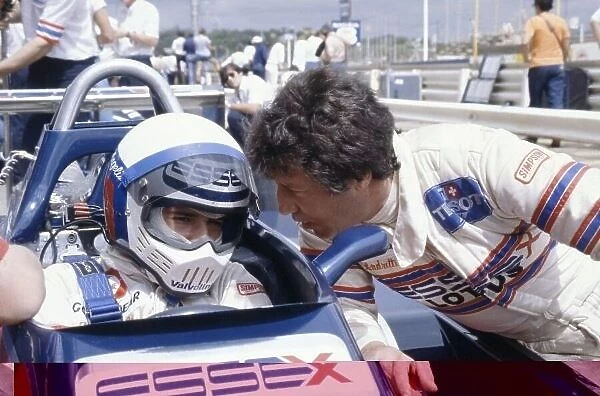 1980 South African Grand Prix. Kyalami, South Africa. 28 February-1 March 1980. Elio de Angelis (Lotus 81-Ford Cosworth) with team-mate Mario Andretti. Portrait in helmet. World Copyright: LAT Photographic Ref: 35mm transparency 80SA23