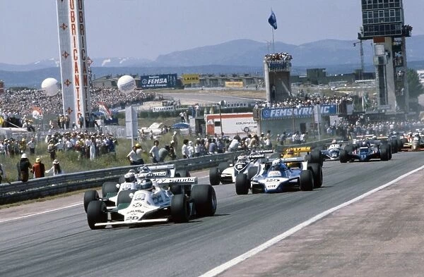 1980 Spanish Grand Prix.: Carlos Reutemann, retired, leads Alan Jones 1st position, leads at the start, action