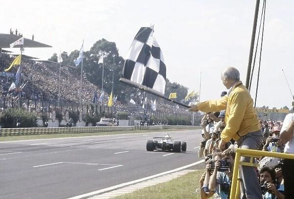 1981 Argentinian Grand Prix. Buenos Aires, Argentina. 10-12 April 1981. Juan Manuel Fangio shows the chequered flag to Carlos Reutemann (Williams FW07C-Ford Cosworth), 2nd position. World Copyright: LAT Photographic Ref: 35mm transparency 81ARG02