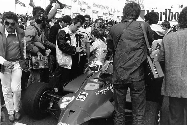 1981 Belgian Grand Prix: Gilles Villeneuve sits with team mate Didier Pironi before the start of the race, portrait