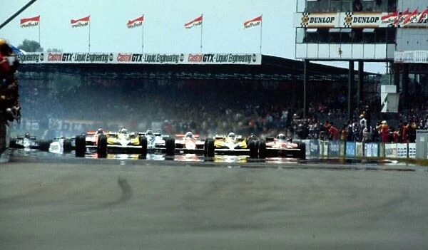 1981 BRITISH GP. The start of the race. Pole man Rene Arnoux leads the field along