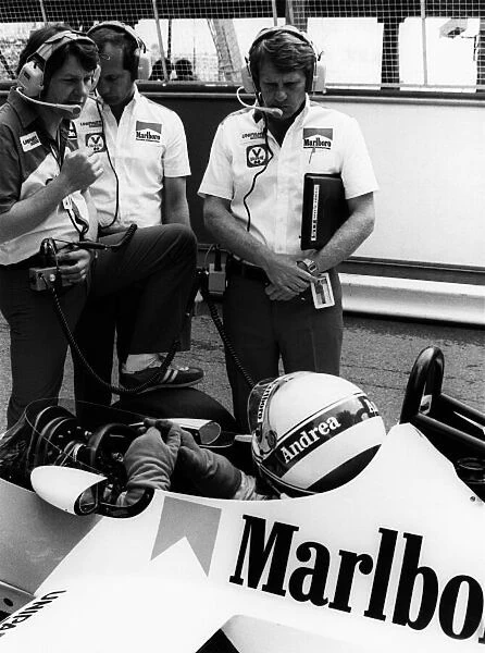1981 Formula 1 World Championship. Andrea de Cesaris ((McLaren MP4  /  1-Ford Cosworth), in conversation with John Barnard, Ron Dennis and Tyler Alexander in the pits, portrait. World Copyright: LAT Photographic