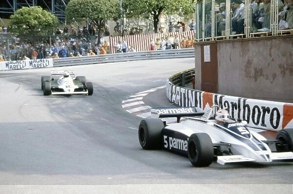 1981 Monaco Grand Prix. Monte Carlo, Monaco. 28-31 May 1981. Nelson Piquet (Brabham BT49C-Ford Cosworth) leads Alan Jones (Williams FW07C-Ford Cosworth). World Copyright: LAT Photographic Ref: 35mm transparency 81MON48