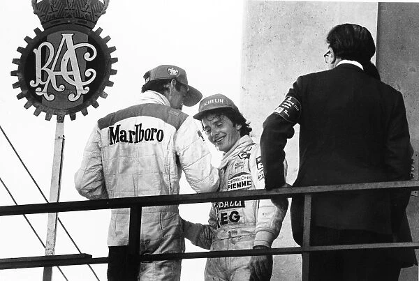 1981 Spanish Grand Prix: Gilles Villeneuve, 1st position, on the podium with John Watson, 3rd position, portrait