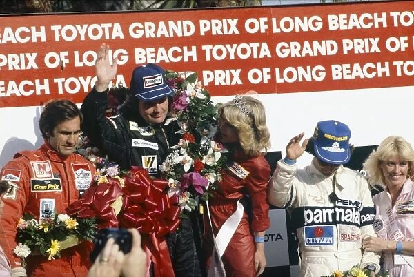 1981 United States Grand Prix West: Alan Jones, 1st position, Carlos Reutemann, 2nd position and Nelson Piquet, 3rd position, on the podium