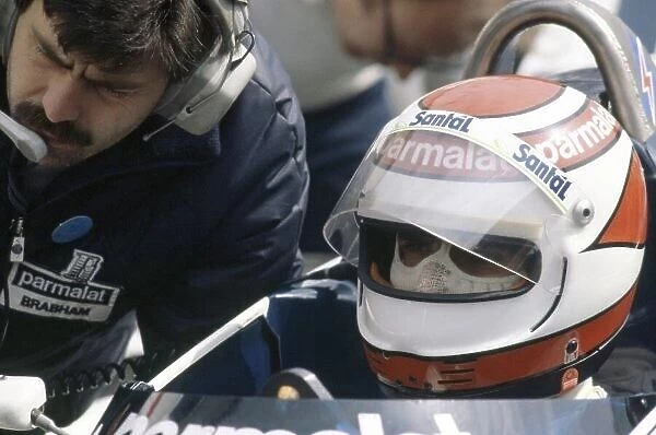 1982 Belgian Grand Prix. Zolder, Belgium. 7-9 May 1982. Nelson Piquet (Brabham BT50-BMW) with designer Gordon Murray. Piquet finished in 5th position. Portrait, helmet. World Copyright: LAT Photographic Ref: 35mm transparency 82BEL54