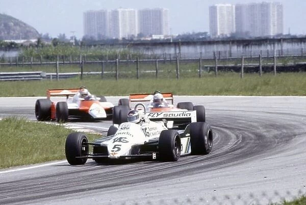 1982 Brazilian Grand Prix. Rio de Janeiro, Brazil. 19-21 March 1982. Carlos Reutemann (Williams FW07C-Ford Cosworth) leads Niki Lauda and John Watson (both McLaren MP4 / 1B-Ford Cosworth). World Copyright: LAT Photographic Ref