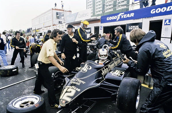 1982 Canadian Grand Prix. Montreal, Canada. 13 June 1982. Nigel Mansell (Lotus 91-Ford), retired, pit lane action. World Copyright: LAT Photographic
