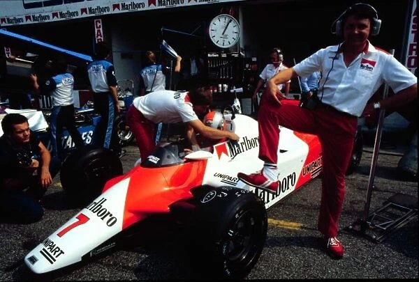 1982 ITALIAN GP. John Barnard stands proud next to the McLaren MP4B Cosworth V8