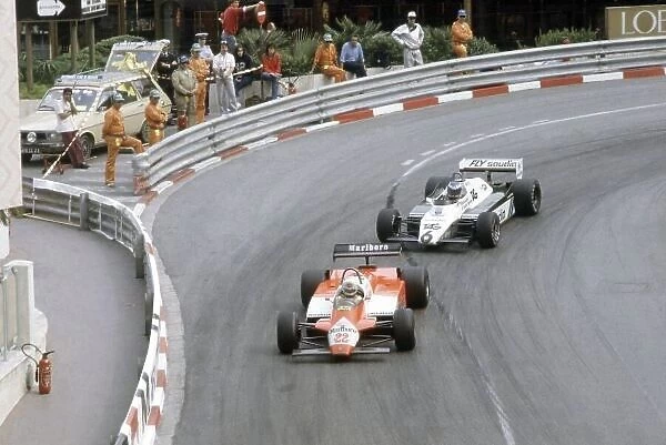 1982 Monaco Grand Prix. Monte Carlo, Monaco. 20-23 May 1982. Andrea de Cesaris (Alfa Romeo 182) leads Keke Rosberg (Williams FW08-Ford Cosworth). World Copyright: LAT Photographic Ref: 35mm transparency 82MON28