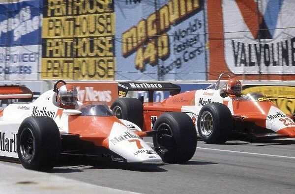 1982 United States Grand Prix West. Long Beach, California, USA. 2-4 April 1982. John Watson (#7 McLaren MP4 / 1B-Ford Cosworth) and Bruno Giacomelli (Alfa Romeo 182)