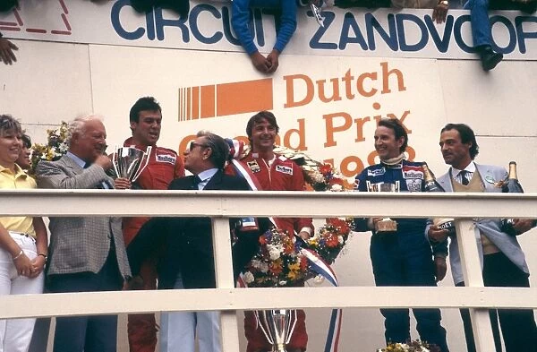 1983 Dutch Grand Prix: Rene Arnoux, 1st position, Patrick Tambay, 2nd position and John Watson 3rd position on the podium