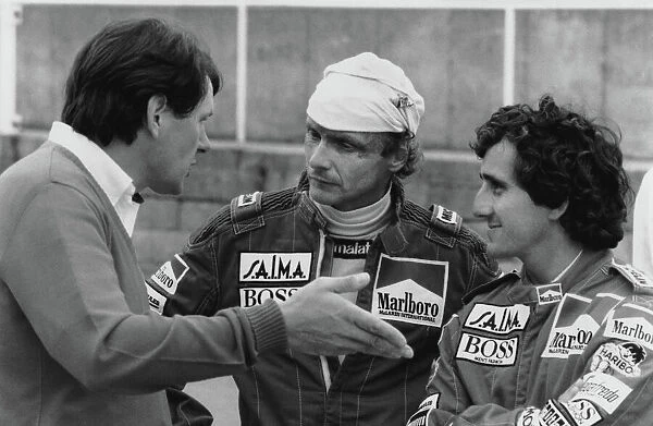 1984 British Grand Prix: Brands Hatch, England. 20th - 22nd July 1984. John Barnard in conversation with Niki Lauda 1st position and Alain Prost