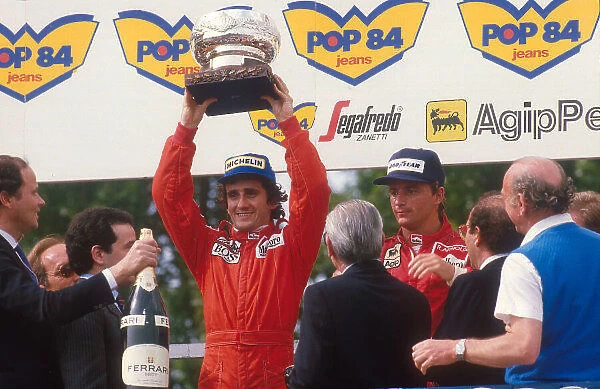 1984 San Marino Grand Prix. Imola, Italy. 4-6 May 1984. Alain Prost (McLaren TAG Porsche) 1st position and Rene Arnoux (Ferrari) 2nd position on the podium. World Copyright - LAT Photographic