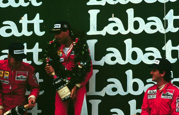 1985 CANADIAN GP. Michele Alboreto stands at the top of the podium after winning in