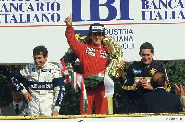 1985 Italian Grand Prix. Monza, Italy. 6th - 8th September 1985. Alain Prost (McLaren MP4 / 2B-TAG Porsche) 1st position, celebrates with Nelson Piquet (Brabham BT54-BMW) 2nd position and Ayrton Senna (Lotus 97T-Renault) 3rd position, on the podium