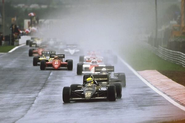 1985 Portuguese Grand Prix - Start: Ayrton Senna leads teammate Elio de Angelis, Alain Prost and Michele Alboreto at the start, action