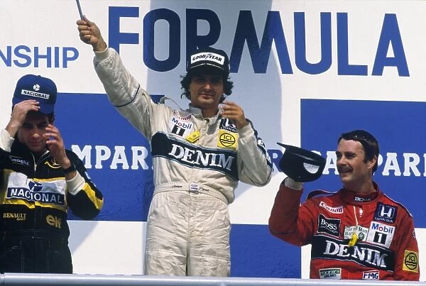1986 German Grand Prix: Nelson Piquet 1st position, Ayrton Senna 2nd position, and Nigel Mansell 3rd position, on the podium. Portrait