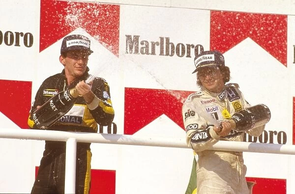 1986 Hungarian Grand Prix: Nelson Piquet 1st position with Ayrton Senna 2nd position on the podium