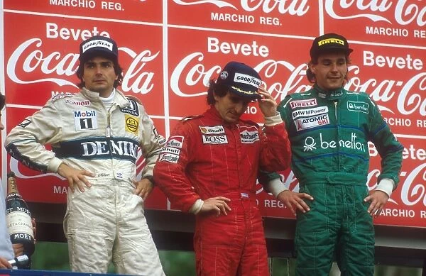 1986 San Marino Grand Prix: Alain Prost 1st position, Nelson Piquet 2nd position and Gerhard Berger 3rd position on the podium