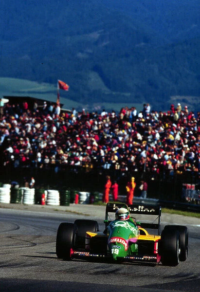 1987 AUSTRIAN GP. Teo Fabi, Benetton Ford, finishes 3rd on the podium. Photo: LAT