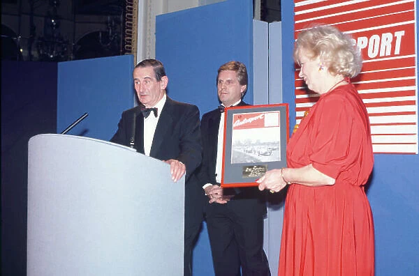 1989 Autosport Awards. Cafe Royal, London, England. 4th January 1990. John Webb receives the first ever Gregor Grant Award from Mrs Grant, portrait. World Copyright: LAT Photographic. Ref: Colour Transparency