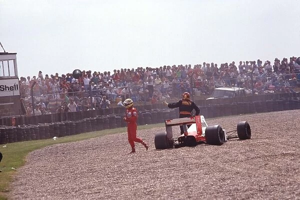 1989 British Grand Prix: Ayrton Senna retires from the race after a gearbox failure spins him off into the gravel trap