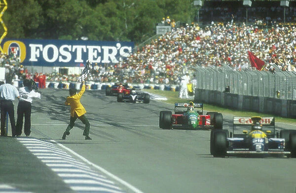 1990 Australian Grand Prix. Adelaide, Australia. 2-4 November 1990. Nelson Piquet (Benetton Ford) takes the chequered flag for 1st position, with Nigel Mansell (Ferrari 641)