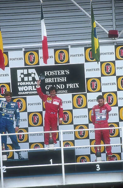 1990 British Grand Prix. Silverstone, England. 13-15 July 1990. Alain Prost (Ferrari) celebrates his 1st position with Thierry Boutsen (Williams Renault) 2nd position and Ayrton Senna (McLaren Honda)